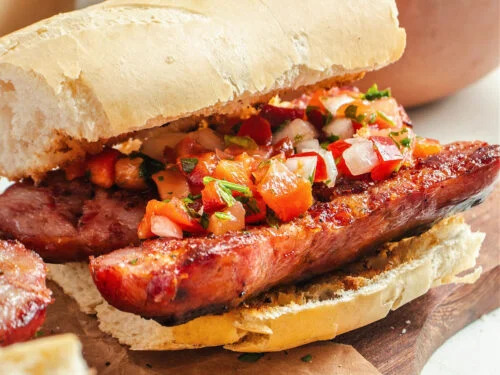 Authentic Argentine choripán street food with chimichurri in Buenos Aires.
